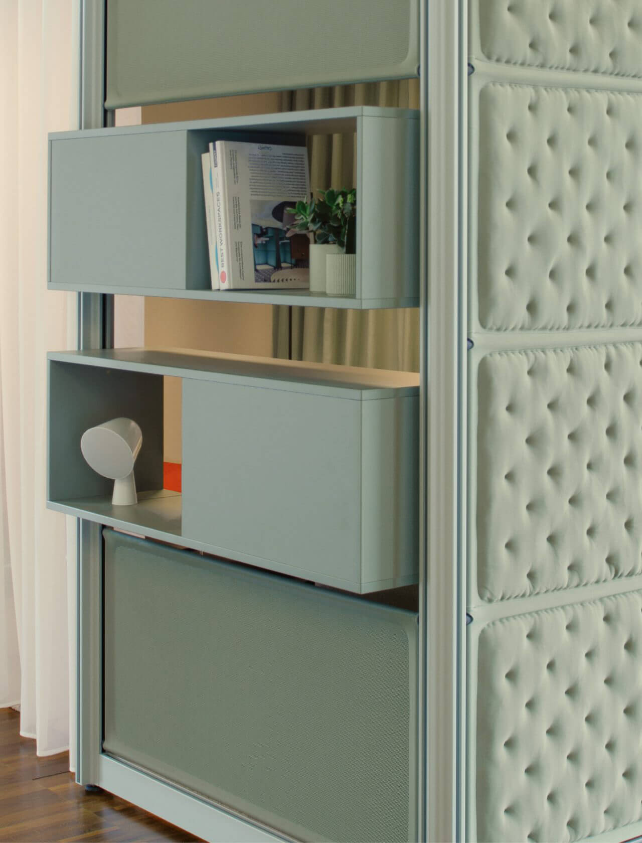 Office lounge with sound-absorbing 3D knitted wall panels creating a quiet retreat zone – POINTS system by Bene