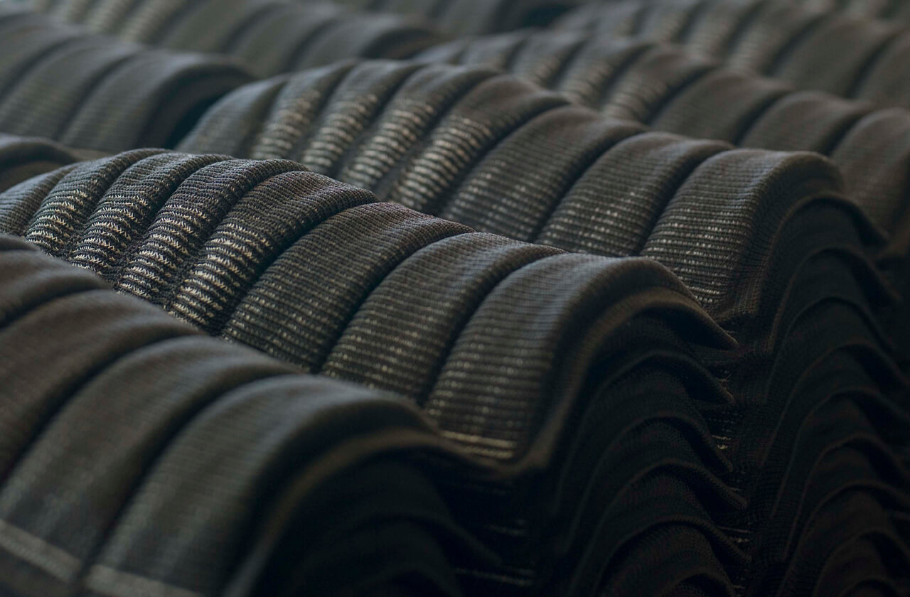 Black 3D knitted loop spacer with wave structure for energy absorption – dimension and shape defined by design