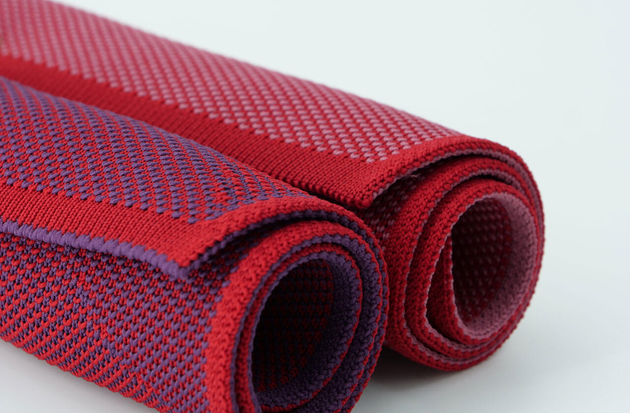 Rolled seamless knitted polyester seat covers with load-adapted zones – structural integrity and flexibility in the fabric
