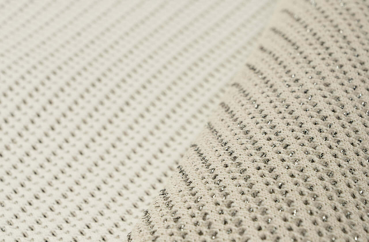 Close-up of a shape-knitted ventilation structure with functional zones knitted directly into the fabric
